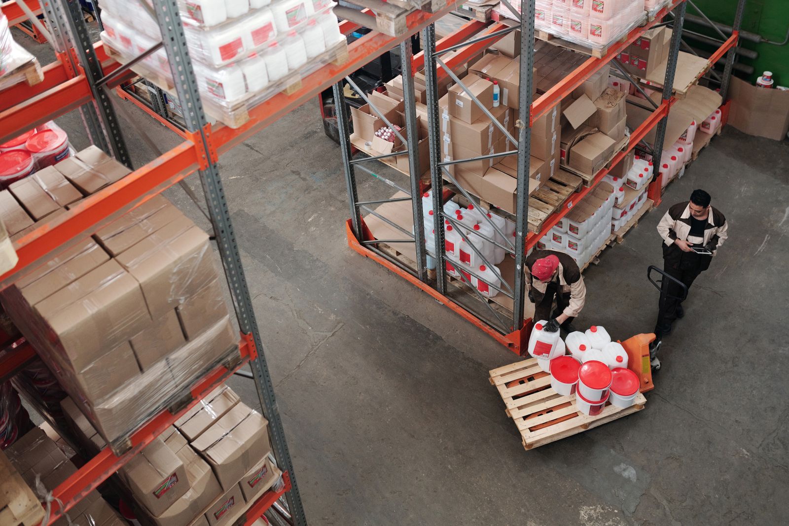 Warehouse crew organising stock at a depot